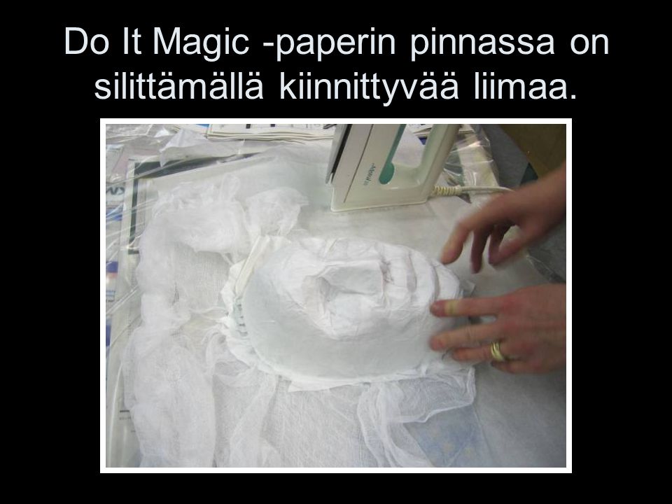 Do It Magic -paperin pinnassa on silittämällä kiinnittyvää liimaa.